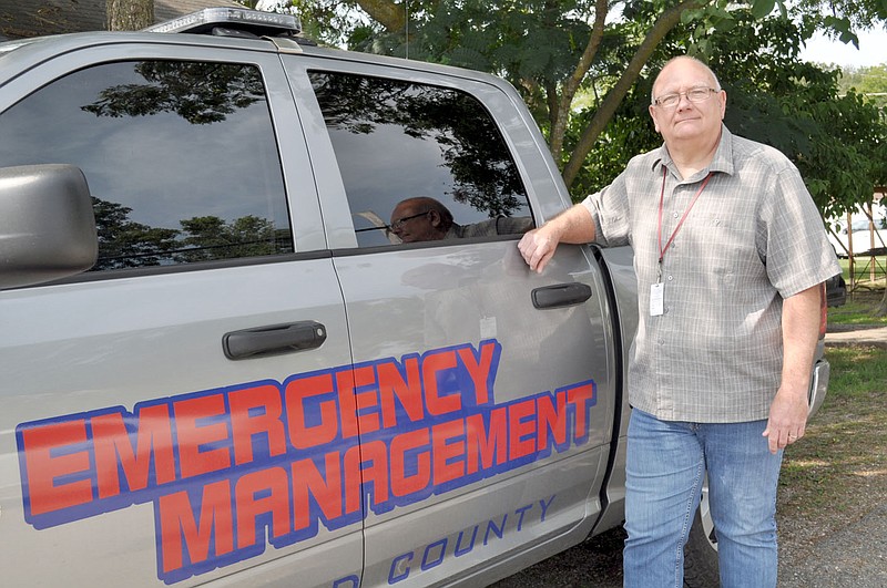 RACHEL DICKERSON/MCDONALD COUNTY PRESS Gregg Sweeten, director of the McDonald County Emergency Management Agency, is pictured next to a new truck his office secured through a state grant during the past year.