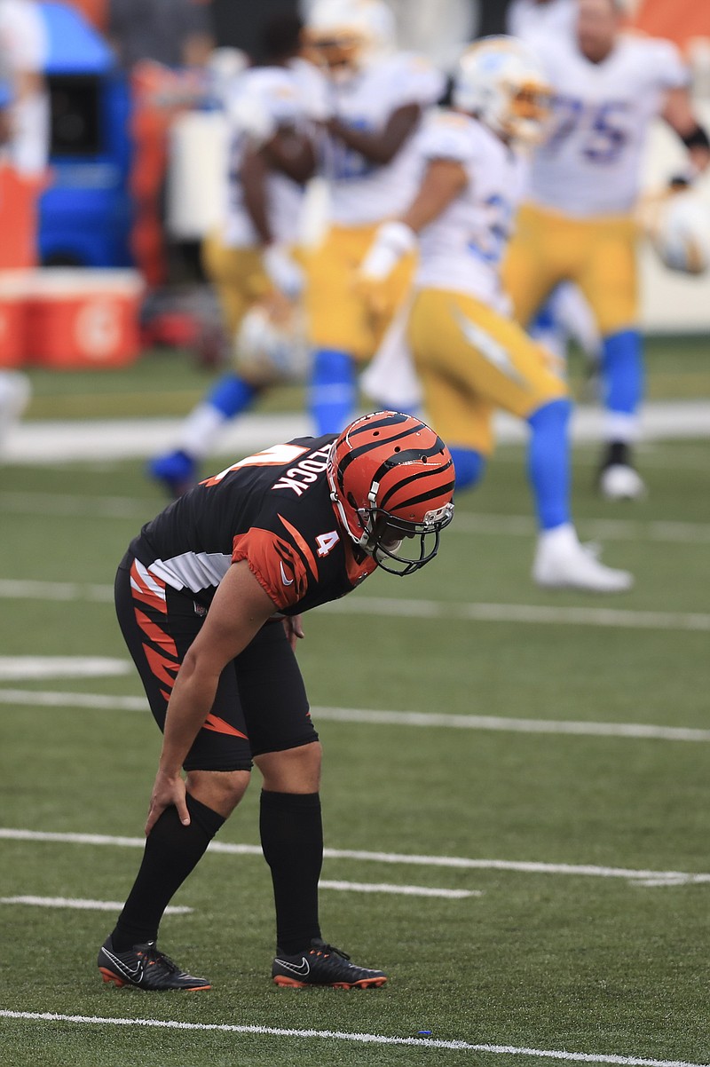 Cincinnati Bengals kicker Randy Bullock (4) grabs is leg after missing a tying field goal during the second half of Sunday's NFL game against the Los Angeles Chargers in Cincinnati. - Photo by Aaron Doster of The Associated Press story.lead_photo.caption