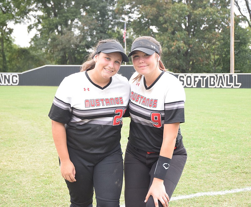 RICK PECK/SPECIAL TO MCDONALD COUNTY PRESS McDonald County High School honored senior members of the Lady Mustang softball team following their 11-1 win over Aurora on Sept. 10 at MCHS. From left to right are Deorica Zamora and Alexa Hopkins.