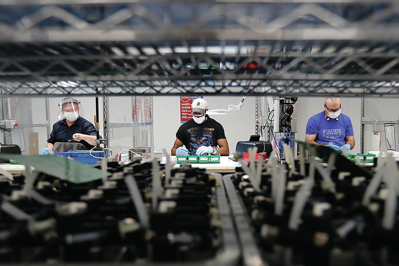 In May, autoworkers were assembling ventilators at a Ford Motor Co. plant in Ypsilanti Township, Mich., during efforts to ramp up production of the crucial machines. (AP) 