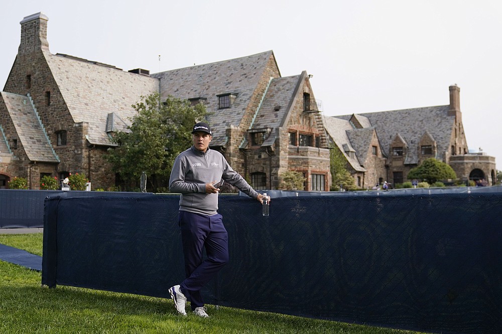 Sami Valimaki, of Finland, waits outside the clubhouse before practicing for the U.S. Open Championship golf tournament, Tuesday, Sept. 15, 2020, at the Winged Foot Golf Club in Mamaroneck, N.Y. (AP Photo/Charles Krupa)