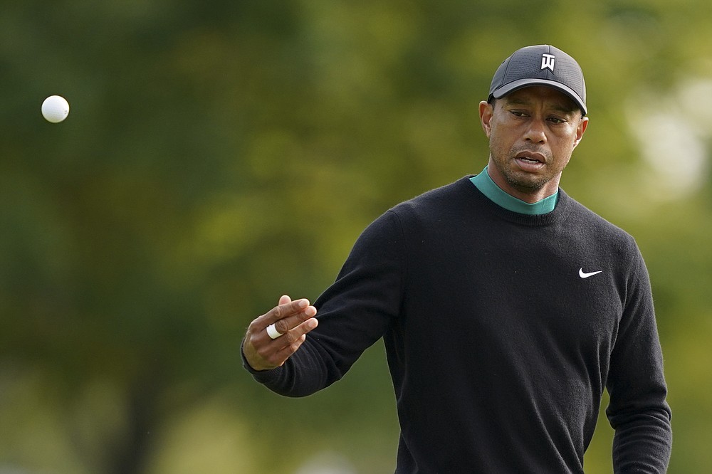 Tiger Woods tosses a ball onto the 11th green during practice for the U.S. Open Championship golf tournament at Winged Foot Golf Club, Tuesday, Sept. 15, 2020, in Mamaroneck, N.Y. (AP Photo/John Minchillo)