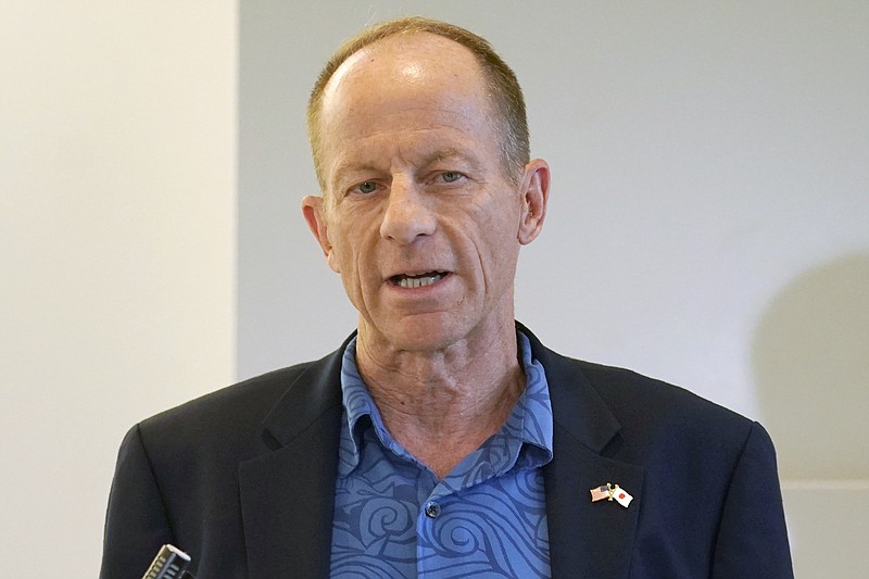 FILE - In this July 11, 2019, file photo, U.S. Assistant Secretary of State for East Asian and Pacific Affairs, David Stilwell speaks to media as he arrives at the Narita International Airport in Narita, north of Tokyo. Stilwell accused China on Tuesday of bullying and insincerity in its dealings with Southeast Asian nations, but said Washington isn't forcing the region to choose sides between the two world powers. (AP Photo/Eugene Hoshiko, File)