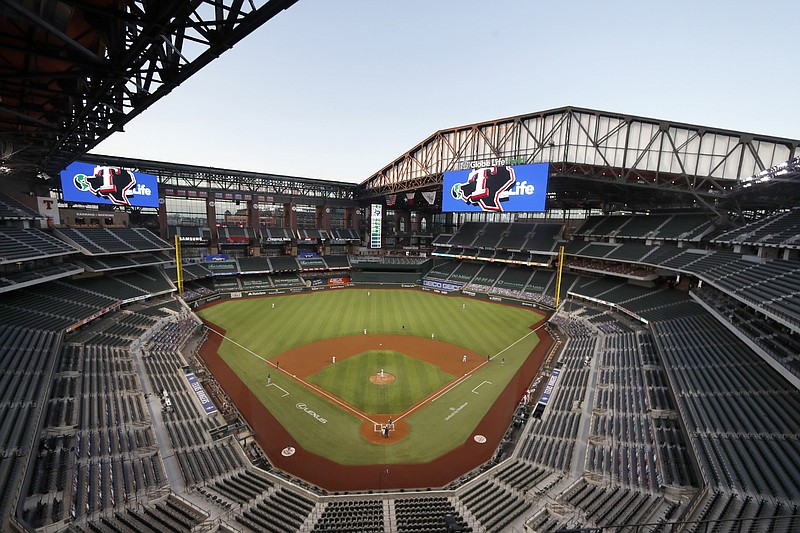 FILE - The Seattle Mariners play the Texas Rangers in the first inning of a baseball game at Globe Life Field in Arlington, Texas, Monday, Aug. 10, 2020. The World Series will be played entirely at the Texas Rangers’ new ballpark in Arlington, Texas, as part of a bubble agreement between Major League Baseball and the players’ association, the first time the sport’s championship will be played entirely at one site since 1944. As part of an agreement finalized Tuesday, Sept. 15, 2020, the Division Series, League Championship Series and World Series will be part of a bubble designed to minimize exposure to the coronavirus. (AP Photo/Tony Gutierrez, File) story.lead_photo.caption