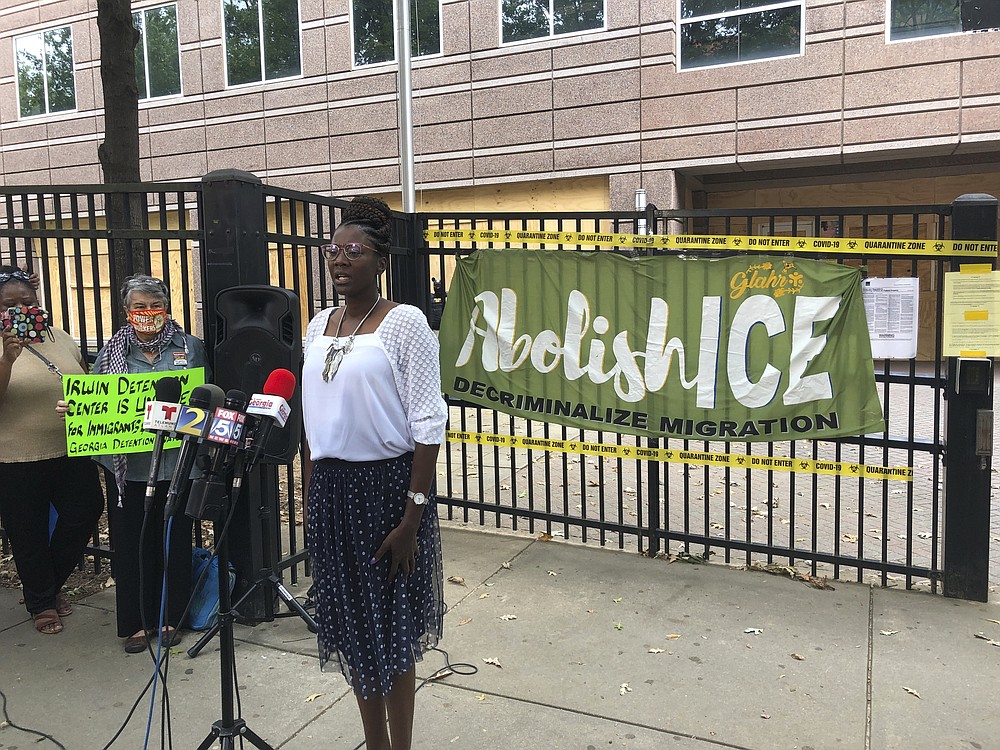 Dawn Wooten, a nurse at Irwin County Detention Center in Ocilla, Georgia, speaks at a Tuesday, Sept. 15, 2020 news conference in Atlanta protesting conditions at the immigration jail. Wooten says authorities denied COVID-19 tests to immigrants, performed questionable hysterectomies and shredded records in a complaint filed to the inspector general of the U.S. Department of Homeland Security. (AP Photo/Jeff Amy)