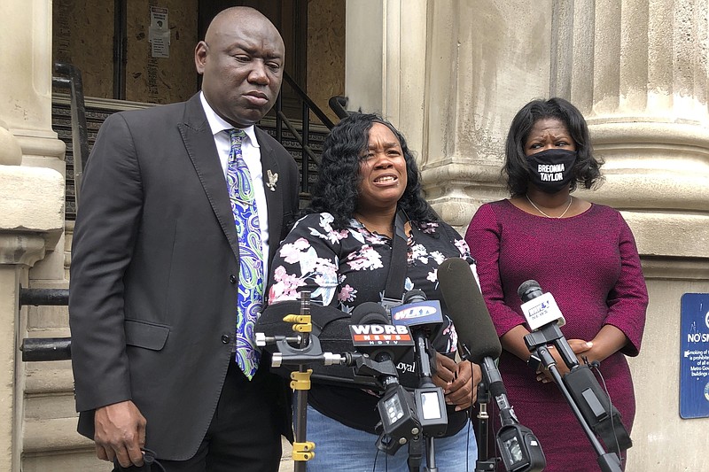 FILE - Tamika Palmer, mother of Breonna Taylor, addresses the media in Louisville, Ky., on Thursday, Aug. 13, 2020. The city of Louisville will pay several million dollars to the mother of Breonna Taylor and install police reforms as part of a settlement of a lawsuit from Taylor’s family, The Associated Press has learned. (AP Photo/Dylan Lovan, FIle)