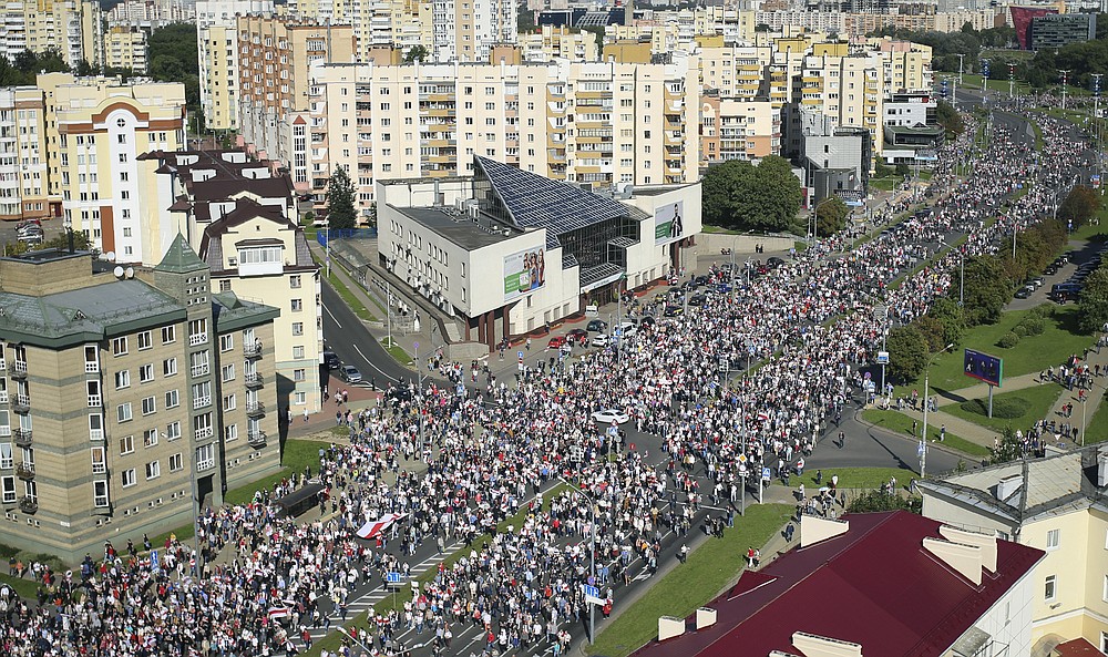 Protesters march during an opposition supporters rally in Minsk, Belarus, Sunday, Sept. 13, 2020. Protests calling for the Belarusian president's resignation have broken out daily since the Aug. 9 presidential election that officials say handed him a sixth term in office. (Tut.by via AP)
