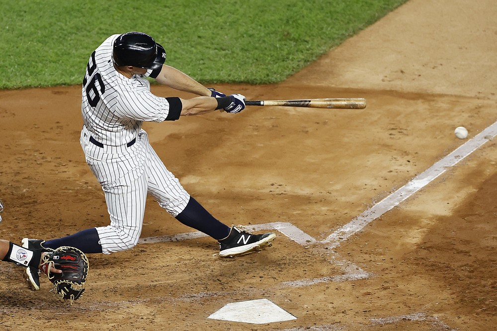 New York Yankees' DJ LeMahieu hits a three-run double during the third inning of the team's baseball game against the Toronto Blue Jays on Tuesday, Sept. 15, 2020, in New York. (AP Photo/Adam Hunger)