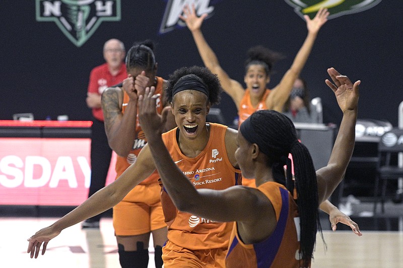 Phoenix Mercury guard Shey Peddy, front, and teammates forward Brianna Turner, center, center Kia Vaughn, left, and guard Skylar Diggins-Smith, rear, react after Peddy scores the game-winning shot as time expired during Tuesday's WNBA first-round playoff game against the Washington Mystics in Bradenton, Fla. - Photo by Phelan M. Ebenhack of The Associated Press story.lead_photo.caption