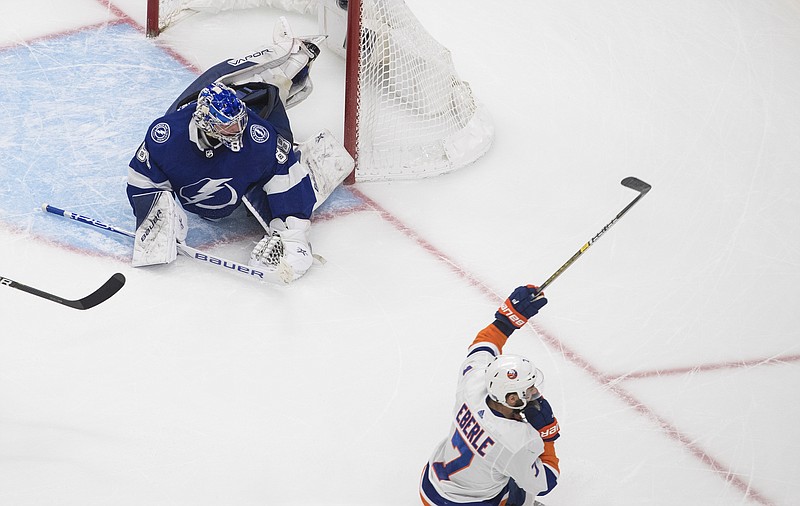 New York Islanders right wing Jordan Eberle (7) celebrates Tuesday after scoring on Tampa Bay Lightning goaltender Andrei Vasilevskiy (88) during the second overtime in Game 5 of the NHL hockey Eastern Conference final in Edmonton, Alberta. - Photo by Jason Franson/The Canadian Press via The Associated Press story.lead_photo.caption