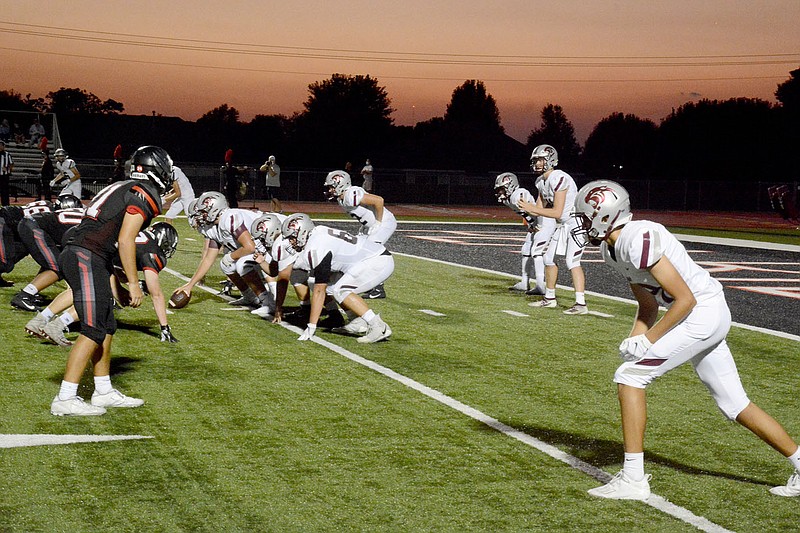 Graham Thomas/Siloam Sunday
The sun sets at Blackhawk Stadium in Pea Ridge as the Siloam Springs offense prepares to snap the ball deep in its own territory. The Panthers' offense is averaging nearly 535 offensive yards per game through its first three games.