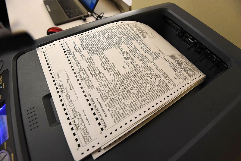 Absentee ballots come out of a printer on Wednesday, Sept. 16, 2020 at the Benton County Clerk's Office. (NWA Democrat-Gazette/Flip Putthoff)