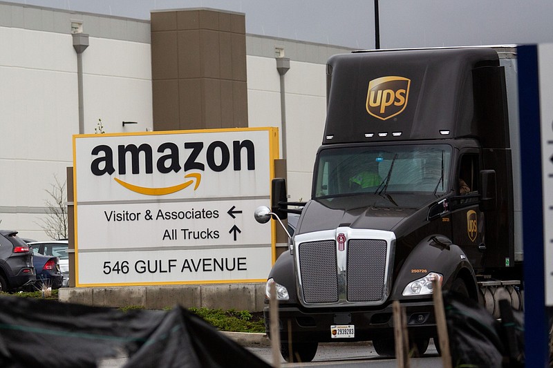 A United Parcel Service truck leaves an Amazon facility in the Staten Island borough of New York on May 1, 2020. (Bloomberg photo by Michael Nagle)