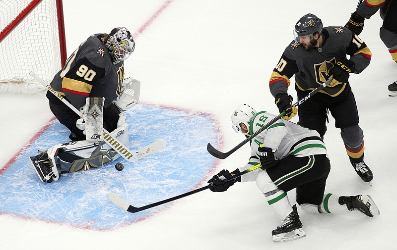 Dallas Stars' Blake Comeau (15) is stopped by Vegas Golden Knights goalie Robin Lehner (90) as Golden Knights' Nicolas Roy (10) defends during first-period NHL Western Conference final playoff game action in Edmonton, Alberta, Monday, Sept. 14, 2020. (Jason Franson/The Canadian Press via AP)