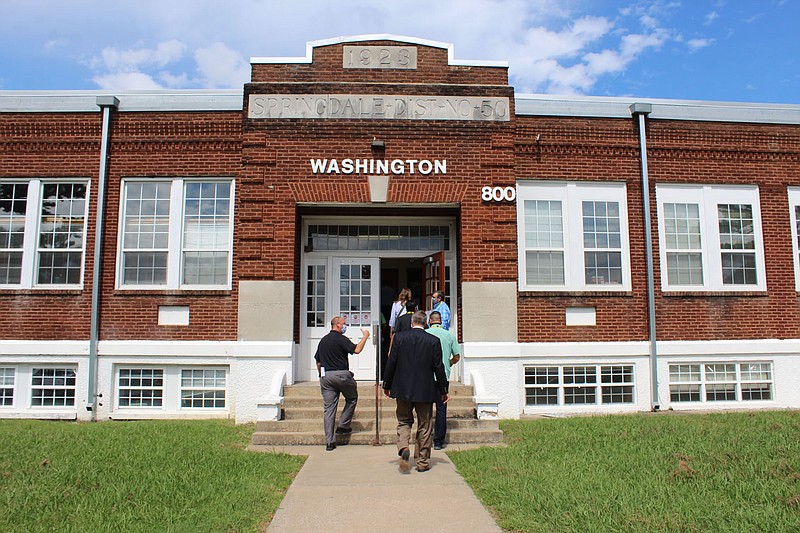 Springdale School District board and staff members enter a district support services building at 800 E. Emma Ave. on Tuesday, Sept. 16, 2020 during a work session to evaluate how the district is using its buildings and properties. (NWA Democrat-Gazette/Mary Jordan)