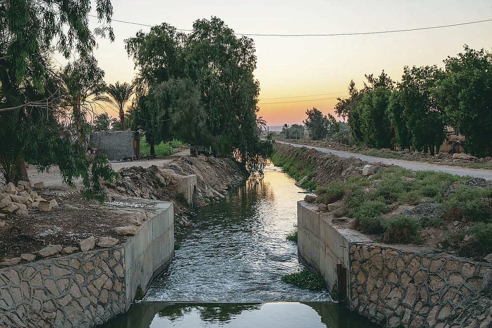 A source of water branching out of the Yusuf Canal, which flows from the Nile through Fayoum, in Qouta town, Egypt, Wednesday, Aug. 5, 2020. Egypt, which relies on the Nile for more than 90% of its water supplies, including drinking water, industrial use and irrigation, fears a devastating impact if The Grand Ethiopian Renaissance Dam is operated without taking its needs into account. (AP Photo/Nariman El-Mofty)