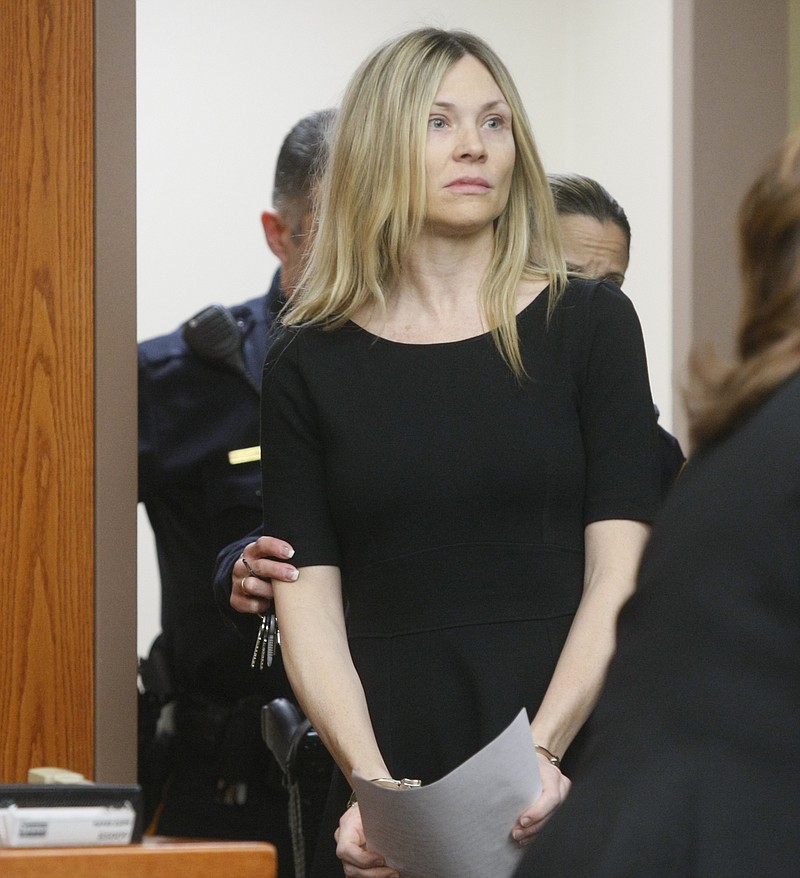 FILE - In this Feb. 14, 2013, file photo, Amy Locane enters the courtroom to be sentenced in Somerville, N.J. The former "Melrose Place" actress who has already served a prison sentence for a fatal 2010 drunken driving crash in New Jersey is headed back behind bars. A state judge on Thursday, Sept. 17, 2020, agreed with prosecutors  that Locane's previous sentences were too lenient and gave the actress an eight-year sentence. (Patti Sapone/NJ Advance Media via AP, Pool, File