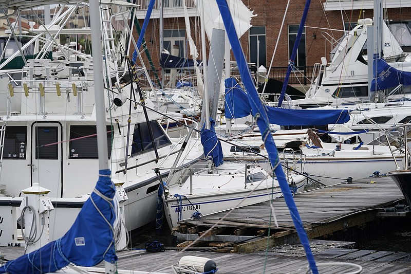 Storm damaged boats sit at the dock in a marina Thursday in Pensacola, Fla. Rivers swollen by Hurricane Sally's rains threatened more misery for parts of the Florida Panhandle and south Alabama on Thursday, as the storm's remnants continued to dump heavy rains inland that spread the threat of flooding to Georgia and the Carolinas. - AP Photo/Gerald Herbert