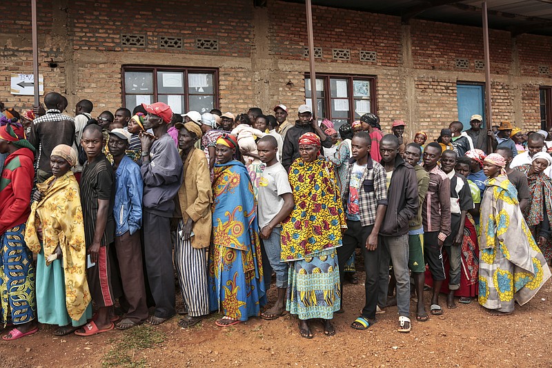 FILE - In this Wednesday, May 20, 2020 file photo, Burundians queue to cast their votes in the presidential election, in Giheta, Gitega province, Burundi.  A new report released Thursday, Sept. 17, 2020, by the United Nations commission of inquiry on Burundi sees little optimism in the government of new President Evariste Ndayishimiye, saying it is "extremely concerned" that he has appointed senior officials who face international sanctions for alleged human rights abuses in the country's 2015 political turmoil. (AP Photo/Berthier Mugiraneza, File)