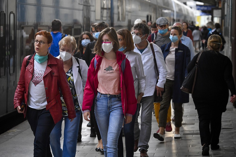 People wearing face masks arrive the Masaryk train station in Prague, Czech Republic, Thursday, Sept. 17, 2020 The number of new confirmed coronavirus infections have hit a record in the Czech Republic, surpassing 2,000 cases in one day for the first time. (Simanek Vit/CTKvia AP)