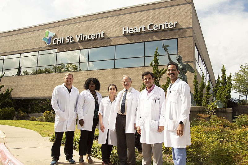 From left, the members of the CHI St. Vincent Cardiology team, shown standing in front of their department’s building, are Dr. Jason Pelton, Dr. Oyidie Igbokidi, Dr. Nazneen Tata, Dr. Michael Frais, Dr. Yuba Acharya and Dr. Srinivas Vengala. - Submitted photo