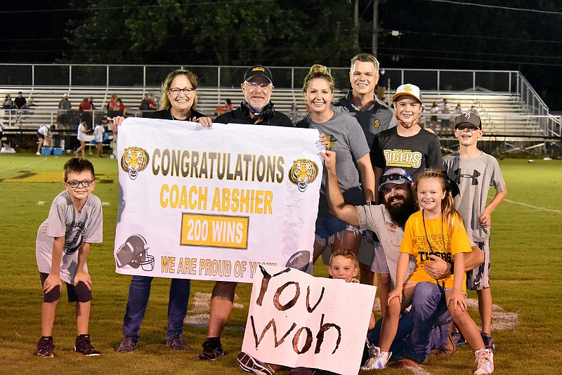 Danny Abshier celebrates with family members after earning his 200th career victory at Prairie Grove with a 19-7 win over Famington Sept. 4. Abshier took over a losing program at Prairie Grove and built it into one that's won 64 percent (201-113) of its game in the 28 years he's coached the Tigers.
(photo submitted by Shelley Williams, Prairie Grove High School.)