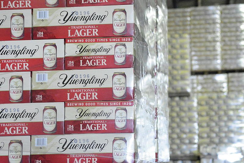 Cases of canned Yuengling Traditional Lager are stacked in the warehouse of the D.G. Yuengling & Son Brewery Mill Creek plant on Tuesday, July 21, 2020, in Pottsville, Pa. Pottsville, Pennsylvania-based D.G. Yuengling and Son Inc. said Tuesday, Sept. itís forming a joint venture with Molson Coors Beverage Co. to expand distribution of its beers beyond the East Coast. Yuengling, a 191-year-old family-owned brewery known for its cheap German-style lager, will remain independent.(Lindsey Shuey/Republican-Herald via AP, File)