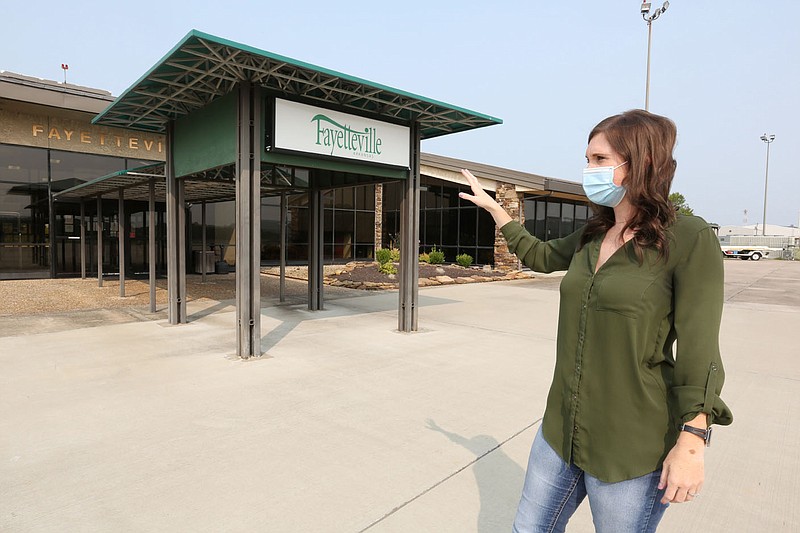 Summer Fallen, airport services manager at Fayetteville Municipal Airport, describes Friday, September 18, 2020, the renovation work that will be taking place in the terminal. The airport received a Federal Aviation Administration grant for $1.3 million to make energy efficiency improvements to its terminal, including replacing windows and improving the building's heating and air-conditioning systems. Check out nwaonline.com/200919Daily/ and nwadg.com/photos for a photo gallery.
(NWA Democrat-Gazette/David Gottschalk)