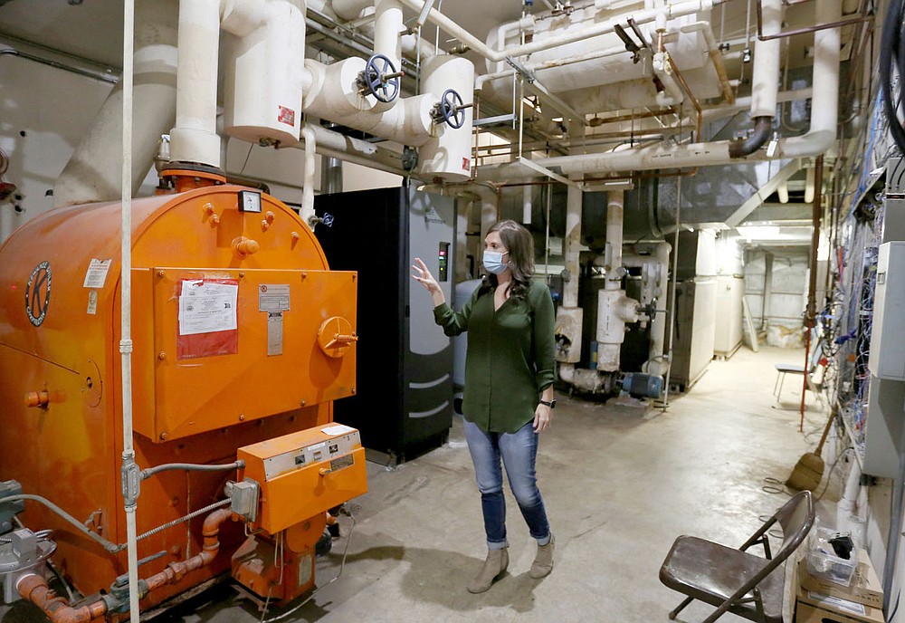 Summer Fallen, airport services manager at Fayetteville Municipal Airport, describes Friday, September 18, 2020, the renovation work that will take place in the mechanical room in the terminal at the airport. The airport received a Federal Aviation Administration grant for $1.3 million to make energy efficiency improvements to its terminal, including replacing windows and improving the building's heating and air-conditioning systems. Check out nwaonline.com/200919Daily/ and nwadg.com/photos for a photo gallery.
(NWA Democrat-Gazette/David Gottschalk)