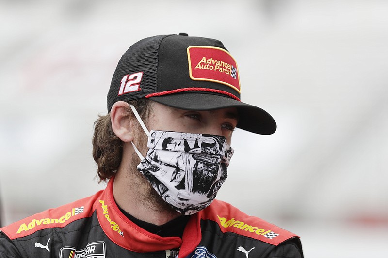 Ryan Blaney waiting in pit row before a June 7 NASCAR Cup Series auto race at Atlanta Motor Speedway in Hampton, Ga. With a bit of disbelief over his fast fall in NASCAR's standings, Ryan Blaney is determined to avoid elimination from the playoffs. - Photo by Brynn Anderson of The Associated Press