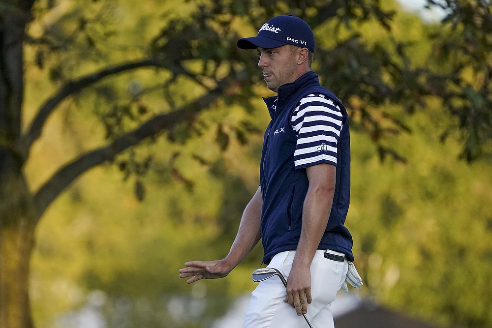 Justin Thomas, of the United States, reacts to his putt on the eighth green during the second round of the US Open Golf Championship, Friday, Sept. 18, 2020, in Mamaroneck, N.Y. (AP Photo/John Minchillo)