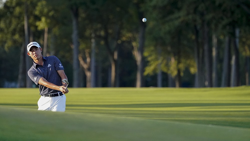 Collin Morikawa, of the United States, chips onto the eighth green during the second round of the US Open Golf Championship, Friday, Sept. 18, 2020, in Mamaroneck, N.Y. (AP Photo/John Minchillo)