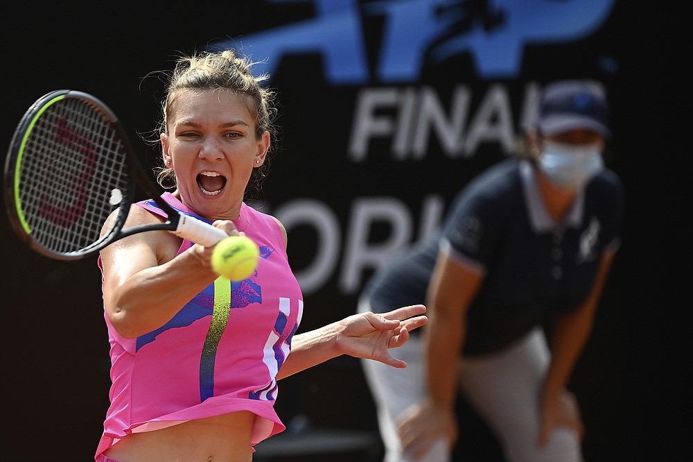 Simona Halep returns the ball to Yulia Putintseva during their quarterfinal match at the Italian Open tennis tournament, in Rome, Saturday, Sept. 19, 2020. (Alfredo Falcone/LaPresse via AP)