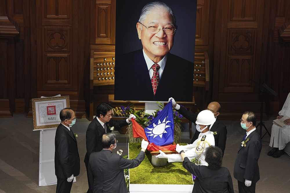 A Taiwanese flag is laid during a memorial service for the late former Taiwanese President Lee Teng-hui in Taipei, Taiwan on Saturday, Sept. 19, 2020. Lee, remembered for leading the island's transition to democracy, died at age 97 in July, (Pool Photo via AP Photo)