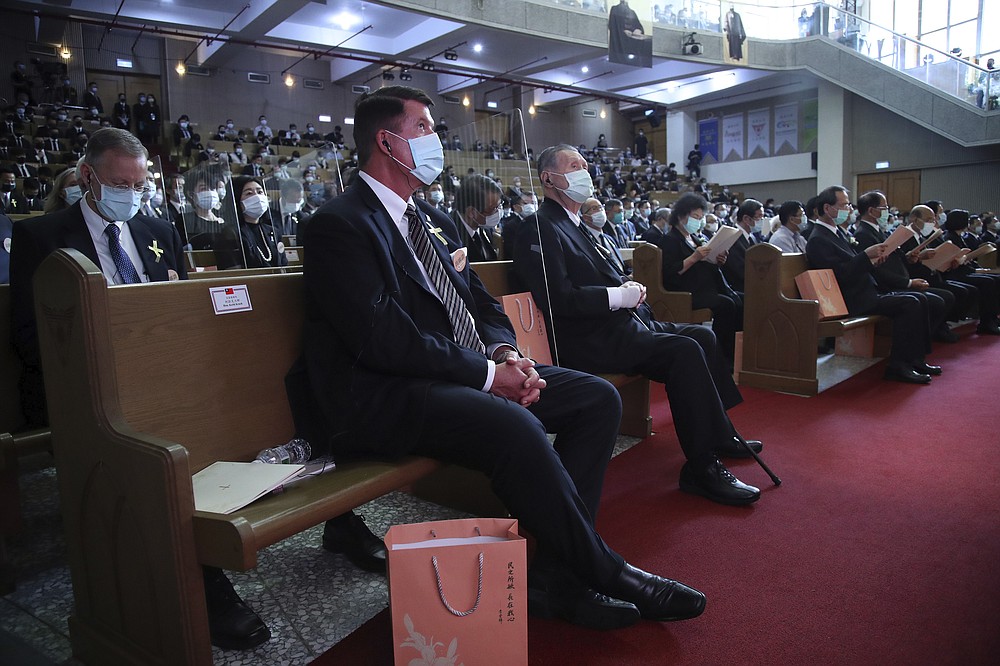 U.S. Undersecretary of State Keith Krach, center and former Japanese Prime Minister Yoshiro Mori at right attend a memorial service for the late former Taiwanese President Lee Teng-hui in Taipei, Taiwan on Saturday, Sept. 19, 2020. Lee, remembered for leading the island's transition to democracy, died at age 97 in July, (Pool Photo via AP Photo)