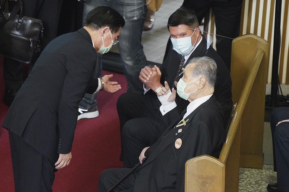 Former Japanese Prime Minister Yoshiro Mori, center is seated next to U.S. Under Secretary of State Keith Krach, at a memorial service for the late former Taiwanese President Lee Teng-hui in Taipei, Taiwan on Saturday, Sept. 19, 2020. Lee, remembered for leading the island's transition to democracy, died at age 97 in July, (Pool Photo via AP)