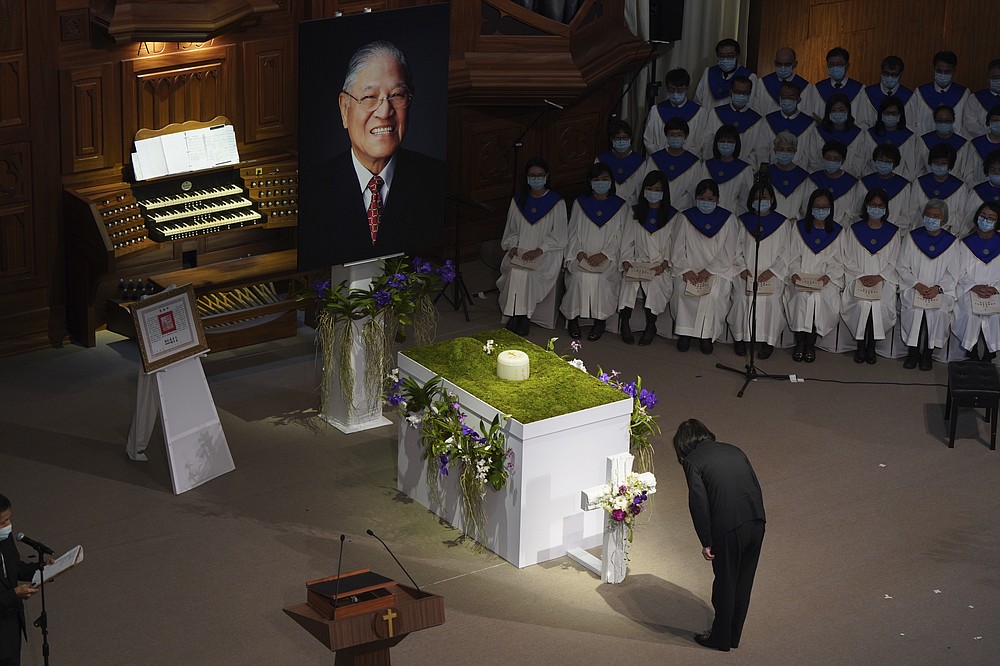 Taiwan President Tsai Ing-wen bows during a memorial service for the late former Taiwanese President Lee Teng-hui in Taipei, Taiwan on Saturday, Sept. 19, 2020. Lee, remembered for leading the island's transition to democracy, died at age 97 in July, (Pool Photo via AP)