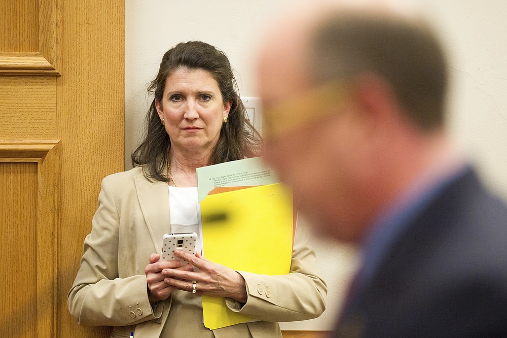 FILE - In this March 15, 2016 file photo, Rep. Susan Lynn, R-Mt. Juliet, listens to the testimony during a House subcommittee hearing in Nashville, Tenn. Walmart, Amazon and other corporate giants donated money to Lynn's re-election campaign after she used social media to amplify and promote the QAnon conspiracy theory. That's according to an Associated Press review of campaign finance records and online posts by Republican state Rep. Susan Lynn.(AP Photo/Erik Schelzig, File)