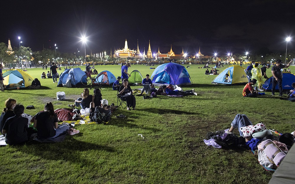 Pro-democracy protesters sleep at Sanam Luang field during protest in Bangkok, Thailand, Saturday, Sept. 19, 2020. Thousands of demonstrators turned out Saturday for a rally to support the student-led protest movement's demands for new elections and reform of the monarchy. (AP Photo/Wason Wanichakorn)