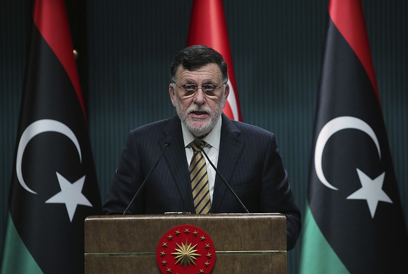 FILE - In this June 4, 2020 file photo, Fayez Sarraj, the head of Libya's internationally-recognized government, speaks at a joint news conference with Turkey's President Recep Tayyip Erdogan, in Ankara, Turkey.   Libya’s U.N.-supported government Friday, Aug. 21, 2020, announced a cease-fire across the oil-rich country and called for demilitarizing the strategic city of Sirte, which is controlled by rival forces.  (Turkish Presidency via AP, Pool)