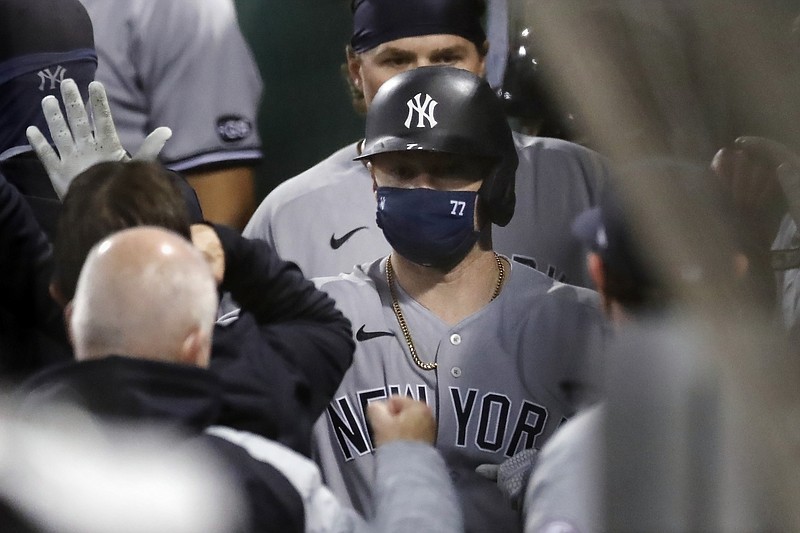 New York Yankees' Clint Frazier (77) celebrates his two-run home run that also drove in Luke Voit, behind, during the fifth inning of a baseball game against the Boston Red Sox, Saturday, Sept. 19, 2020, in Boston. (AP Photo/Michael Dwyer)