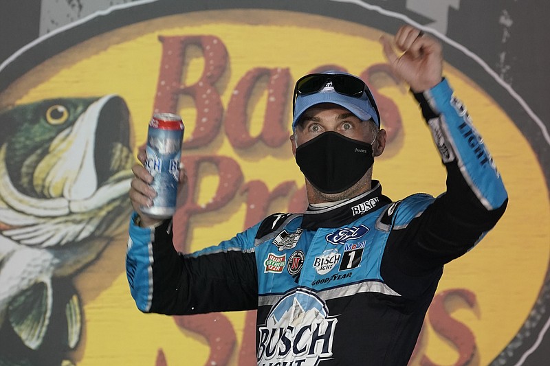 Kevin Harvick celebrates in Victory Lane after his win in the NASCAR Cup Series auto race Saturday, Sept. 19, 2020, in Bristol, Tenn. (AP Photo/Steve Helber)