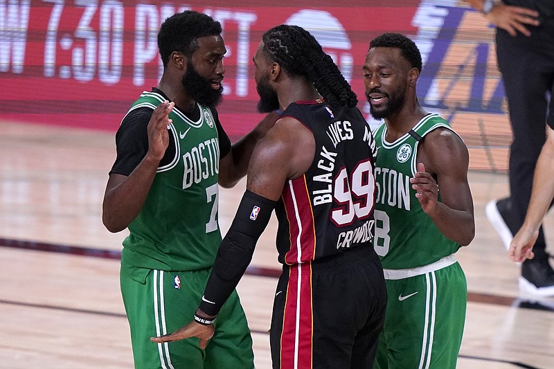 Boston Celtics' Jaylen Brown, left, and Miami Heat's Jae Crowder (99) exchange words as Kemba Walker (8) attempts to calm the situation during the second half of Saturday's NBA conference final playoff game in Lake Buena Vista, Fla. - Photo by Mark J. Terrill of The Associated Press