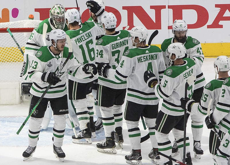The Dallas Stars celebrate their win over the Tampa Bay Lightning in Saturday's NHL Stanley Cup finals game in Edmonton, Alberta. - Jason Franson/The Canadian Press via The Associated Press