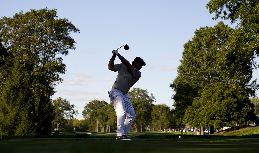 Bryson DeChambeau, of the United States, plays his shot from the 14th tee during the final round of the US Open Golf Championship, Sunday, Sept. 20, 2020, in Mamaroneck, N.Y. (AP Photo/Charles Krupa)