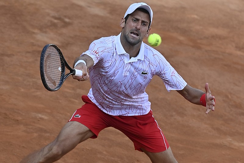 Serbia's Novak Đjoković returns the ball to Norway's Casper Ruud during their semifinal at the Italian Open tennis tournament, in Rome, Sunday, Sept. 20, 2020. (Alfredo Falcone/LaPresse via AP)