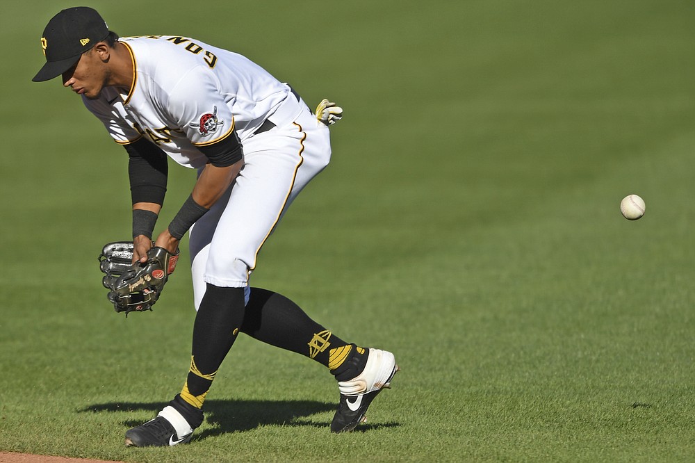 Pittsburgh Pirates' Erik Gonzalez misplays a ball hit by St. Louis Cardinals' Brad Miller during the fourth inning of a baseball game, Sunday, Sept. 20, 2020, in Pittsburgh. (AP Photo/David Dermer) Pennsylvania