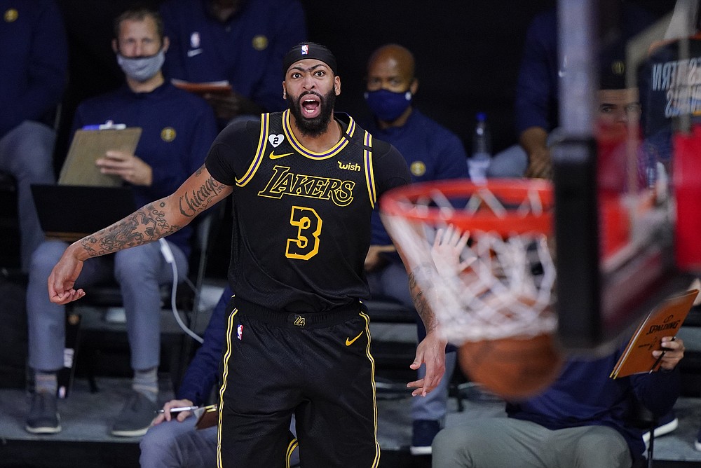 Los Angeles Lakers' Anthony Davis (3) reacts after making a 3-point basket during the second half of an NBA conference final playoff basketball game against the Denver Nuggets Sunday, Sept. 20, 2020, in Lake Buena Vista, Fla. (AP Photo/Mark J. Terrill)