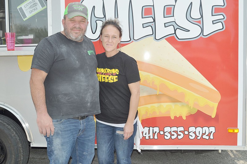 RACHEL DICKERSON/MCDONALD COUNTY PRESS Jeff (left) and Stacey Grissom are the owners of the Hankrins for a Hunk of Cheese gourmet grilled cheese food truck that can be found in Pineville.