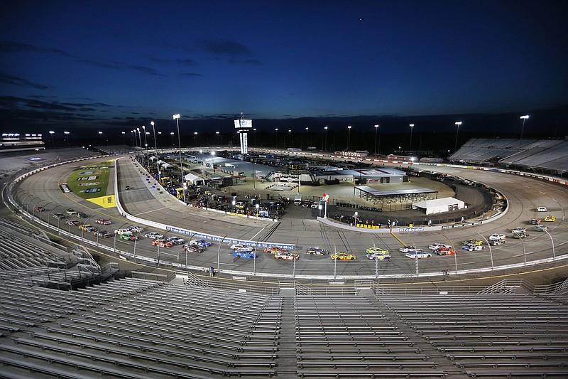 NASCAR Cup Series 63rd Annual Federated Auto Parts 400 at Richmond Raceway, Saturday 9/12/2020. Cars take the first turn amidst empty seats to begin a NASCAR Cup Series auto race Saturday, Sept. 12, 2020, in Richmond, Va. (James Wallace/Richmond Times-Dispatch via AP)